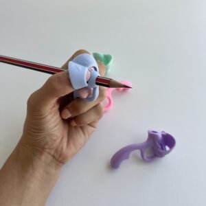 Close-up of a hand comfortably holding a pencil with the light blue 5-finger pencil grip corrector, illustrating correct finger placement for an effective pencil grip.