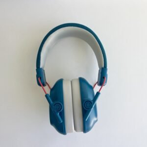 An unfolded blue pair of noise cancelling headphones for children, viewed from the front, highlighting the adjustable headband and ear cups on a white background.
