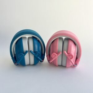 A blue and a pink pair of noise cancelling headphones for kids, both folded compactly, viewed from the front against a white background, demonstrating portability.