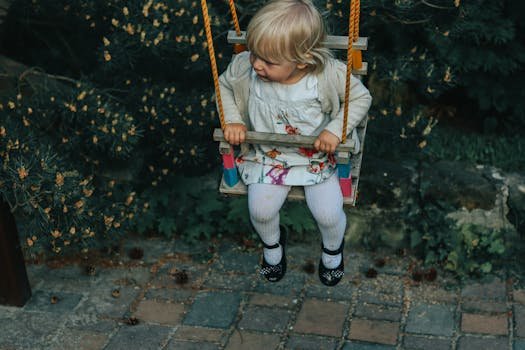 Child enjoying vestibular input and self-regulation on a lycra sensory swing