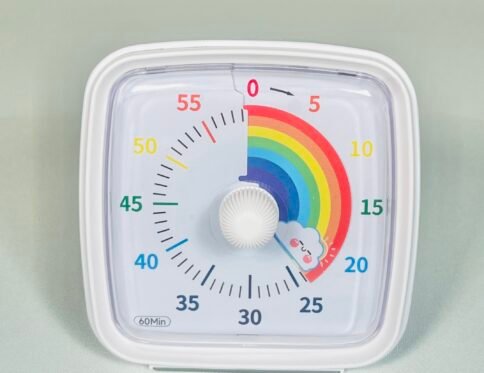 White square visual clock timer showing a colourful rainbow countdown, set to 60 minutes, with a central white knob. Ideal for kids with autism or ADHD to manage time.