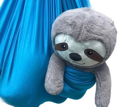 Lycra sensory swing in blue with soft sloth toy zoomed in